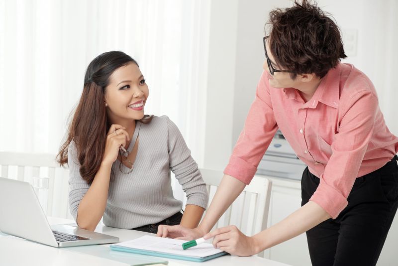 cheerfu cooperating man woman office